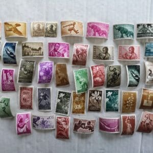 Colorful vintage postage stamps arranged on display.