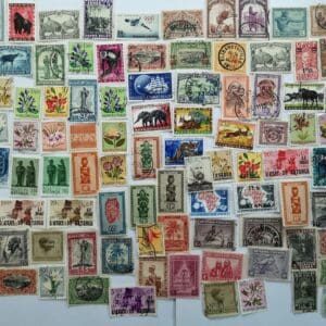 Assorted vintage postage stamps on white background
