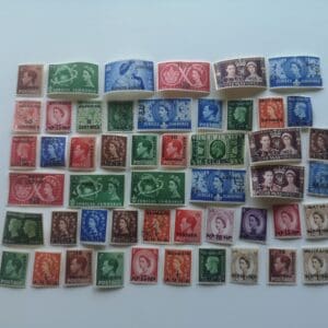 Colorful vintage postage stamps with monarch portraits