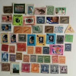 Assorted vintage postage stamps on white background