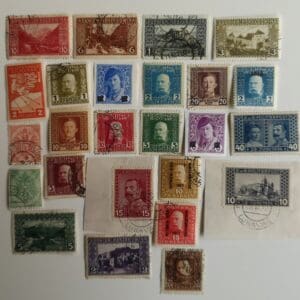 Assorted vintage postage stamps on white background
