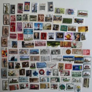 Assorted international postage stamps on white background