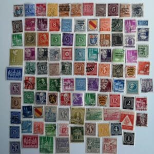 Assorted vintage postage stamps on white background