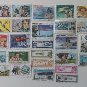 Collection of vintage aviation-themed postage stamps.