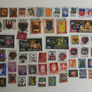 Collection of colorful vintage heraldic postage stamps