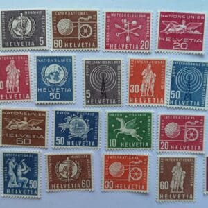Collection of colorful Helvetia postage stamps.