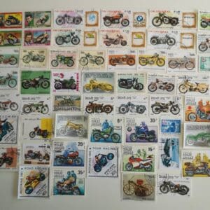 Collection of vintage motorcycle postage stamps.