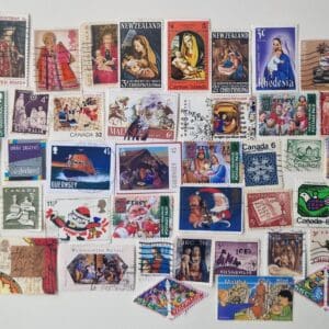 Assorted colorful international postage stamps on white