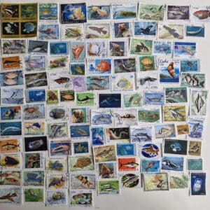 Collection of colorful fish-themed postage stamps.