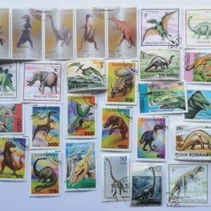 Dinosaur-themed postage stamps collection assortment.