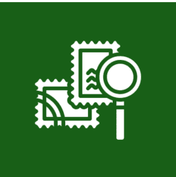 Magnifying glass examining two postage stamps.