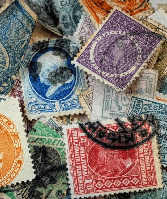 Colorful vintage international postage stamp collage